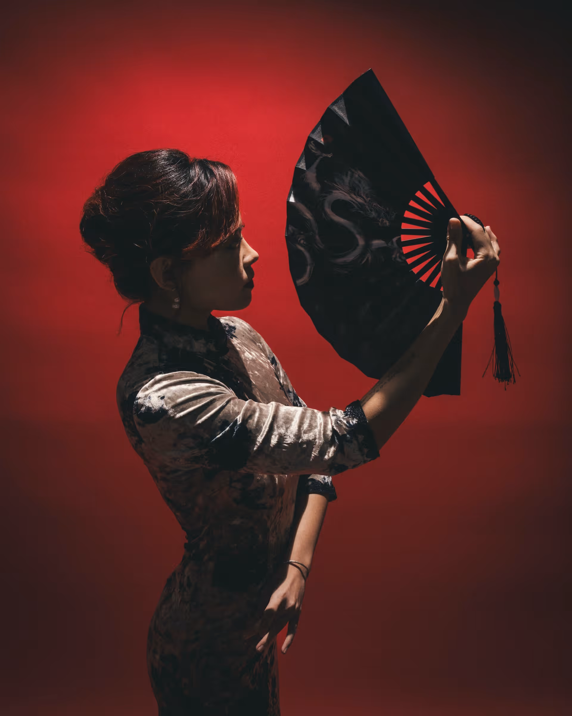 Wanli Wang practicing flow arts with silk fans and sword — frame 8